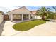 Backyard featuring artificial turf, covered patio, and palm trees at 6222 Eliza Ln, North Las Vegas, NV 89031