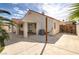 Backyard featuring artificial turf, covered patio, and wood fence at 6222 Eliza Ln, North Las Vegas, NV 89031