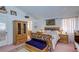 Comfortable bedroom featuring carpet, wood furniture, and window at 6222 Eliza Ln, North Las Vegas, NV 89031