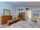 Comfortable bedroom with wood furniture, carpet, and natural light at 6222 Eliza Ln, North Las Vegas, NV 89031