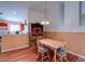 Cozy dining area with a table set for four, adjacent to the open kitchen at 6222 Eliza Ln, North Las Vegas, NV 89031