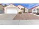 Charming single-story home with low-maintenance desert landscaping and a two-car garage at 6222 Eliza Ln, North Las Vegas, NV 89031