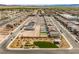 Aerial view of a community featuring a playground, landscaping, walking paths, and mountain views at 6270 Blood Lily Ave, Las Vegas, NV 89122
