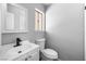 Clean bathroom with modern sink, hardware, and toilet at 6442 Ironbark Ln, Las Vegas, NV 89107