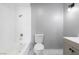 Bright bathroom showcasing a tub-shower combo, tiled wall, and neutral vanity offers clean comfort at 6442 Ironbark Ln, Las Vegas, NV 89107