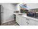 Bright kitchen with new appliances, marble counter tops, and stainless steel sink at 6442 Ironbark Ln, Las Vegas, NV 89107