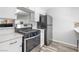 Modern kitchen with new stainless steel appliances and marble counter tops at 6442 Ironbark Ln, Las Vegas, NV 89107