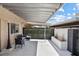 Stylish covered patio with sleek furniture and a peaceful ambiance, creating a perfect outdoor retreat at 6442 Ironbark Ln, Las Vegas, NV 89107