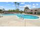 Large community pool surrounded by desert landscaping creates a refreshing oasis at 6442 Ironbark Ln, Las Vegas, NV 89107