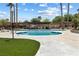 Relaxing community pool with lounge chairs and well-maintained landscaping creates a perfect outdoor retreat at 6442 Ironbark Ln, Las Vegas, NV 89107