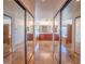 Gorgeous primary bathroom with marble floors, large mirrors, and dual vanities at 7125 Mountain Den Ave, Las Vegas, NV 89179