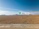 Expansive desert landscape with distant mountains, and tortoise habitat at 7125 Mountain Den Ave, Las Vegas, NV 89179