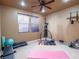 Fully equipped exercise room with weights, punching bag, and carpeted floor at 7125 Mountain Den Ave, Las Vegas, NV 89179