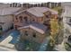 Beautiful two-story home featuring a tile roof and desert landscaping at 7125 Mountain Den Ave, Las Vegas, NV 89179