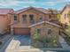Charming home boasts a stone facade, tile roof, and well-maintained landscaping at 7125 Mountain Den Ave, Las Vegas, NV 89179