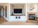 Cozy fireplace and built-in entertainment center featuring a large flat-screen television at 7125 Mountain Den Ave, Las Vegas, NV 89179