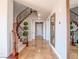 Spacious foyer with winding staircase, travertine flooring, and decorative accents at 7125 Mountain Den Ave, Las Vegas, NV 89179