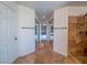 Hallway featuring tiled flooring, closet space, and direct access to the bedroom and shower at 7125 Mountain Den Ave, Las Vegas, NV 89179
