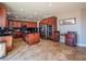Spacious kitchen boasts granite counters, stainless appliances, and travertine floors at 7125 Mountain Den Ave, Las Vegas, NV 89179