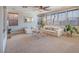Large living room with many windows providing lots of natural light and neutral finishes at 7125 Mountain Den Ave, Las Vegas, NV 89179