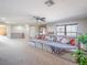 Spacious living room with a sectional sofa, large windows, and stylish decor at 7125 Mountain Den Ave, Las Vegas, NV 89179