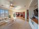 Open-concept living room with kitchen view and comfortable seating arrangement at 7125 Mountain Den Ave, Las Vegas, NV 89179