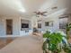 Bright living room featuring a fireplace, media center, and views of a staircase at 7125 Mountain Den Ave, Las Vegas, NV 89179