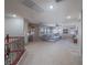 Large living room with plush carpeting, ceiling fan, and comfortable sectional sofa at 7125 Mountain Den Ave, Las Vegas, NV 89179