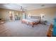 Comfortable main bedroom featuring an ensuite bathroom and bright light fixture at 7125 Mountain Den Ave, Las Vegas, NV 89179