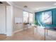 Bright office with blue accent wall, carpet floors, and contemporary furnishings at 7125 Mountain Den Ave, Las Vegas, NV 89179