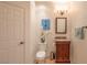 Cozy powder room featuring a charming vanity, decorative lighting, and stylish decor at 7125 Mountain Den Ave, Las Vegas, NV 89179