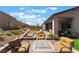 Beautiful backyard with well-maintained plants, lush lawn, and a comfortable lounge area for relaxation at 715 Drammatico Pl, Henderson, NV 89011