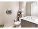 Cozy half-bathroom featuring modern fixtures and stylish decorations at 715 Drammatico Pl, Henderson, NV 89011
