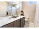 Bright bathroom showcasing double sinks, vanity, neutral colors, and shower with a modern design at 715 Drammatico Pl, Henderson, NV 89011