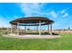 Community shaded picnic and event pavilion in a park setting at 715 Drammatico Pl, Henderson, NV 89011