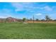 Expansive community green space offering scenic views of distant hills and a peaceful environment for residents at 715 Drammatico Pl, Henderson, NV 89011