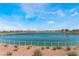 Picturesque community lake surrounded by a walking path, providing a scenic backdrop for residents at 715 Drammatico Pl, Henderson, NV 89011