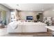 Spacious living room showcases a large white sectional and modern décor at 715 Drammatico Pl, Henderson, NV 89011