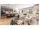 Open-concept living room featuring hardwood floors, neutral decor, and a seamless flow at 715 Drammatico Pl, Henderson, NV 89011