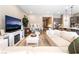 Bright living room featuring a plush sectional sofa, fireplace, and contemporary décor at 715 Drammatico Pl, Henderson, NV 89011