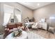 Cozy office space with a desk, couch, and bright natural light at 715 Drammatico Pl, Henderson, NV 89011