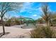 Outdoor playground area featuring a unique green climbing structure on a sunny day at 715 Drammatico Pl, Henderson, NV 89011