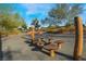 Community park area with mushroom-shaped stepping stones and natural wooden features at 715 Drammatico Pl, Henderson, NV 89011