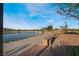 Picturesque walking path beside a peaceful pond, offering residents a serene spot for outdoor activities at 715 Drammatico Pl, Henderson, NV 89011