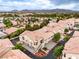 Wonderful aerial perspective of a community with terracotta roofs, and mature trees at 7450 S Eastern Ave # 2073, Las Vegas, NV 89123