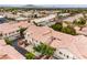 An aerial view of townhomes showcasing the community and tile roofs, near a mountain at 7450 S Eastern Ave # 2073, Las Vegas, NV 89123