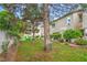 Exterior features a community garden, manicured lawn and mature trees at 7450 S Eastern Ave # 2073, Las Vegas, NV 89123