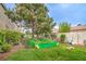 Exterior features a community garden, manicured lawn and mature trees at 7450 S Eastern Ave # 2073, Las Vegas, NV 89123