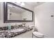 Updated bathroom featuring granite counters, modern sink, faucet, and large framed mirror at 7450 S Eastern Ave # 2073, Las Vegas, NV 89123