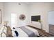 Comfortable bedroom featuring modern decor, neutral colors, and wood floors at 7450 S Eastern Ave # 2073, Las Vegas, NV 89123